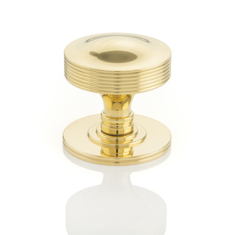 solid brass door knob in polished brass waxed finish
